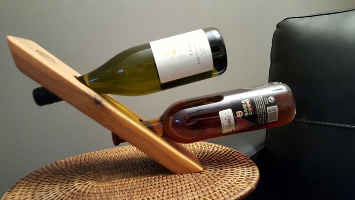 Floating wine bottle holder