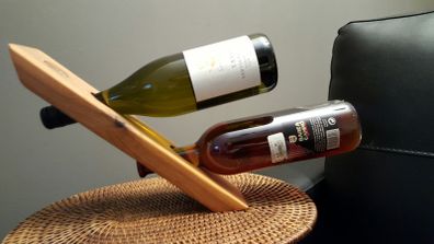 Floating wine bottle holder