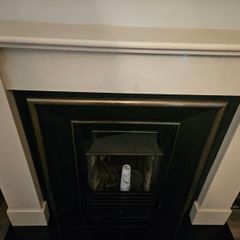 Like new cream and black fireplace for quick sale