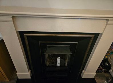 Like new cream and black fireplace for quick sale