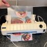 Laminator with laminating pouches Image 2