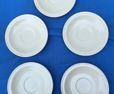 5 vintage white Carrigdhoun Co-Op saucers