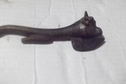 a antique cast iron  tin opener in the shape of a bull