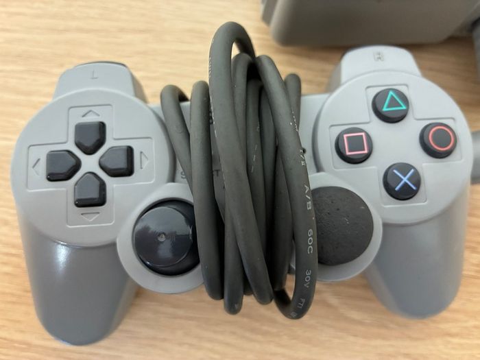 PlayStation console, Dual Shock controller, and all cables