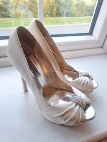Ivory satin peetoe high heel shoes by Dune London with a pleated bow trim accented with rhinestones