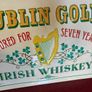 Vintage 'Dublin Gold' metal bar display Image 2
