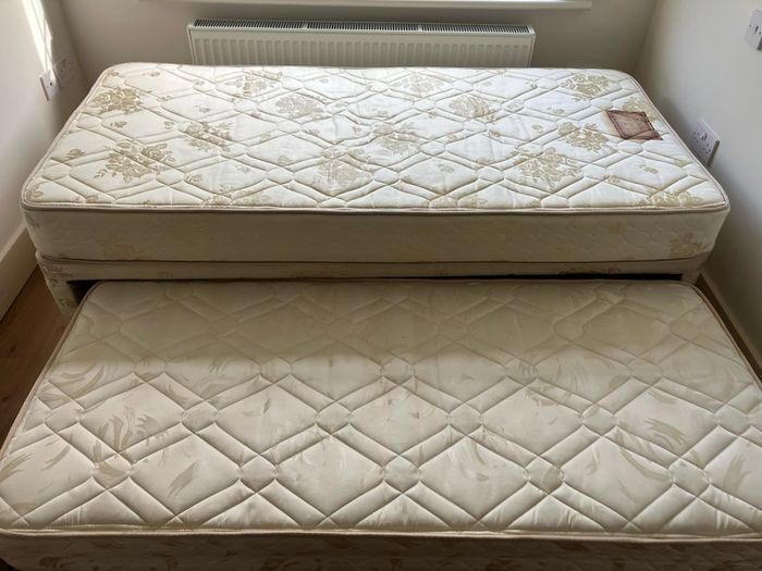 Single bed with pullout bed underneath