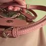 pink Longchamp Le Pliage mini top-handle bag with a detachable shoulder strap Image 10