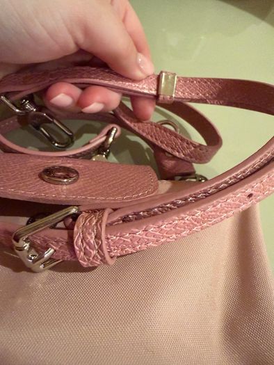 pink Longchamp Le Pliage mini top-handle bag with a detachable shoulder strap