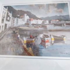 Framed signed print of sea side village.