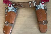 Vintage Lonestar cap guns with caps, leather  holsters with belt with cowboy hat c1960/70s