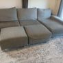 Grey L shaped corner sofa with 2 pouffes. Electric recline on long end Image 2