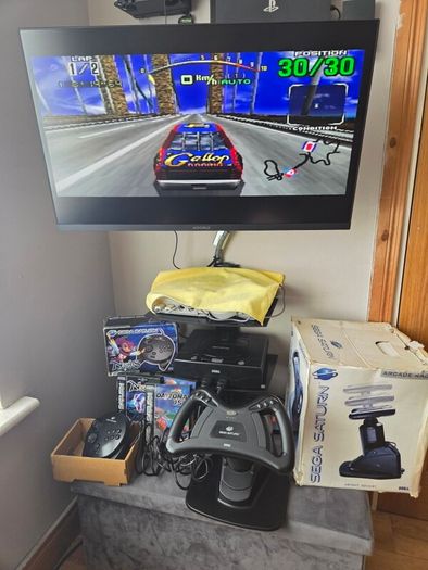 Sega Saturn w/ 3D Control Pad, Arcade Racer, Lightgun and Games