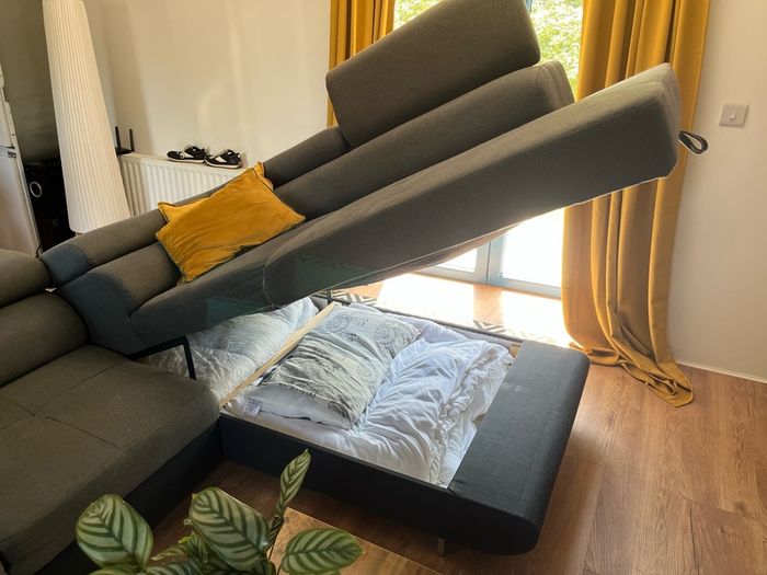 Sofa bed with reclining headrests