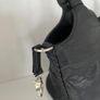 Handbag dressy occasional crossbody bag. Black Medium Size hand bag With Large Flora Feature . Detachable strap. Excellent Condition. Bought In Toulouse. Image 9