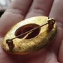 Vintage gold tone brooch. Image 4