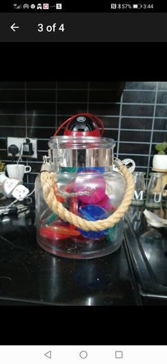large glass candle lantern with coloured lights