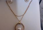 Gold and pearl set of earrings and necklace and pendant set