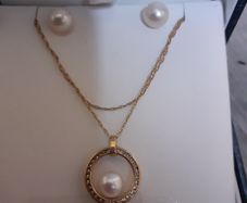 Gold and pearl set of earrings and necklace and pendant set
