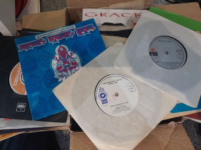 a box of 7" singles. 45 rpm vinyl records.