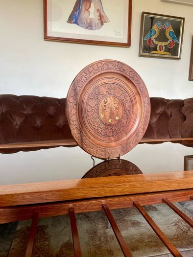 Beautiful vintage hand-carved wooden tray featuring an intricate floral border and a decorative brass inlay geometric star motif in the centre. The craftsmanship is detailed and very tactile, giving this piece a rich, warm character. The tray is solid and