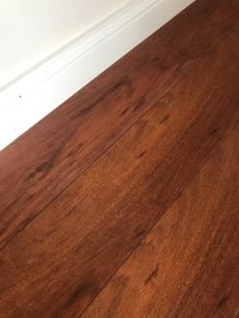 Beautiful Laminate Wood Flooring in dark wood taken up from a room measuring approximately 11 x 7 ft.
