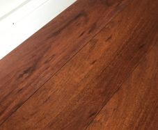 Beautiful Laminate Wood Flooring in dark wood taken up from a room measuring approximately 11 x 7 ft.