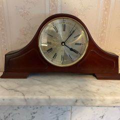Clock and mahogany cabinets