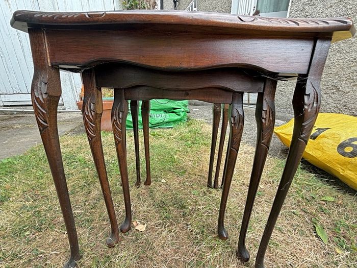 A vintage glass-protected, gold-tooled, leather top nest of tables