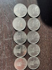 Ten Millennium Pound coins
