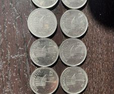 Ten Millennium Pound coins