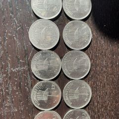 Ten Millennium Pound coins