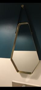 Brass and leather wall mirror