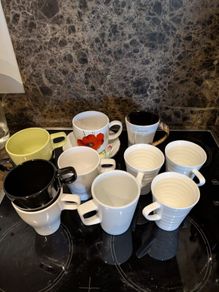 11 mugs and a plate