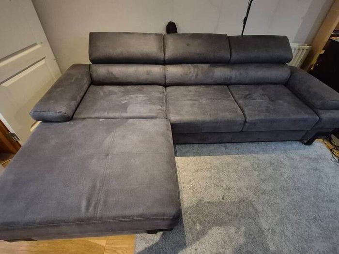 dark grey corner sofa with sleeping and storage