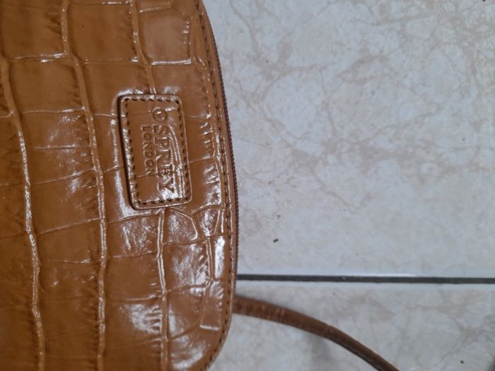 Osprey bag. Small tan leather bag with long shoulder strap