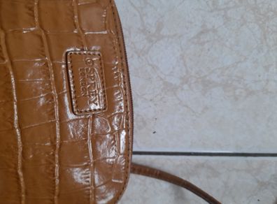 Osprey bag. Small tan leather bag with long shoulder strap