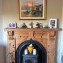 Timber surround with cast iron insert for fireplace Image 4
