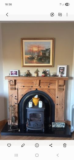Timber surround with cast iron insert for fireplace