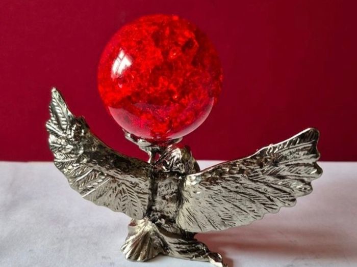 Crackle glass ball and metal angle base.