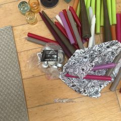 Large collection of  coloured candles and candle holders a few broken and few slightly used