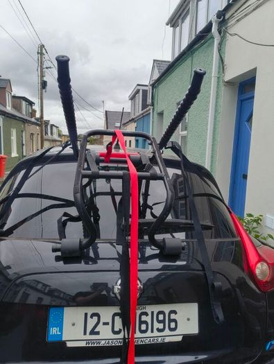 2 mountain bikes and over the trunk bike rack