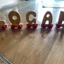 Assortment of wooden letters on wheels Image 2