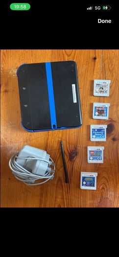 Nintendo 2DS with games and charger