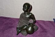 African child with water jug statue