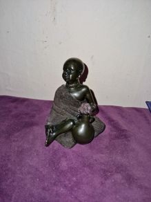 African child with water jug statue
