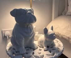 Two ceramic dog ornaments
