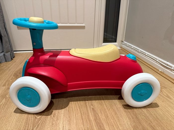 Sit upon toy ride along car