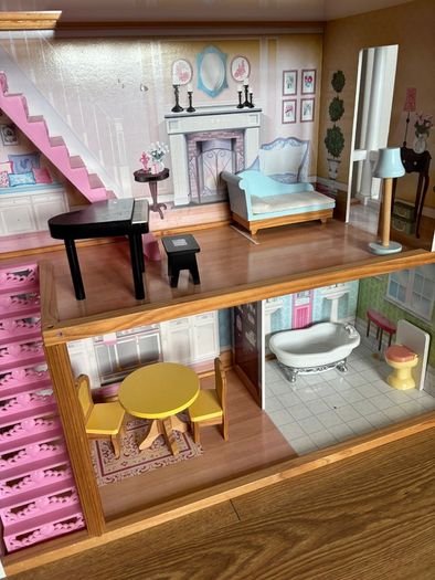 Large wooden dolls house with furniture
