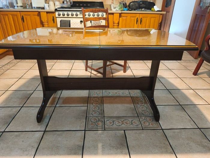 Dining table with glass top and four chairs